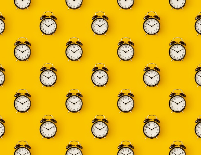 Clocks on a yellow background