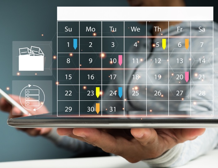 calendar graphic over a laptop